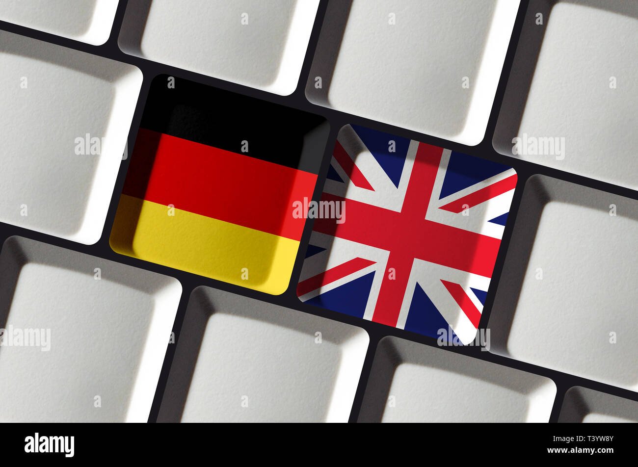 Translate into English or German - Keyboard with flags of Germany and United Kingdom - Red and Green Stock Photo