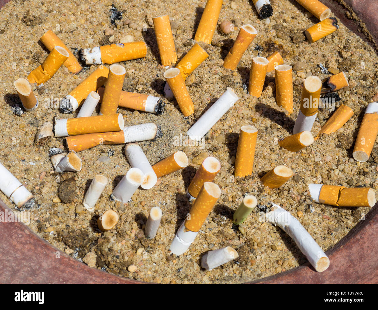 Smoked Cigarettes in the sand ashtray, Stop smoking Concept, unhealthy