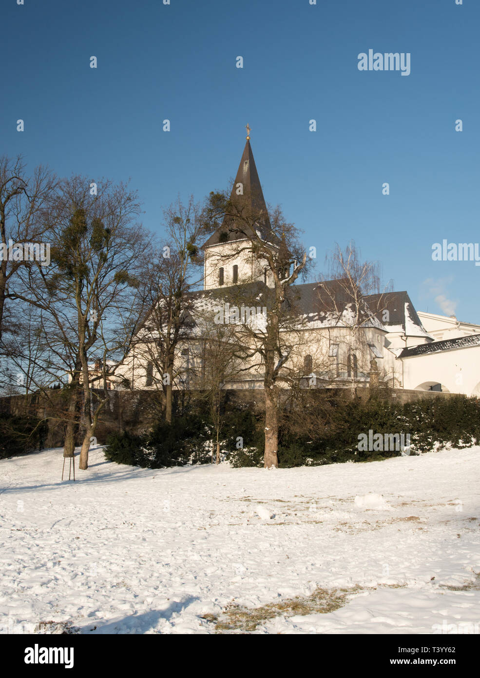 Kostel Povyseni sv. Krize in Karvina - Frystat in Czech republic during beautiful winter day with snow and clear sky Stock Photo