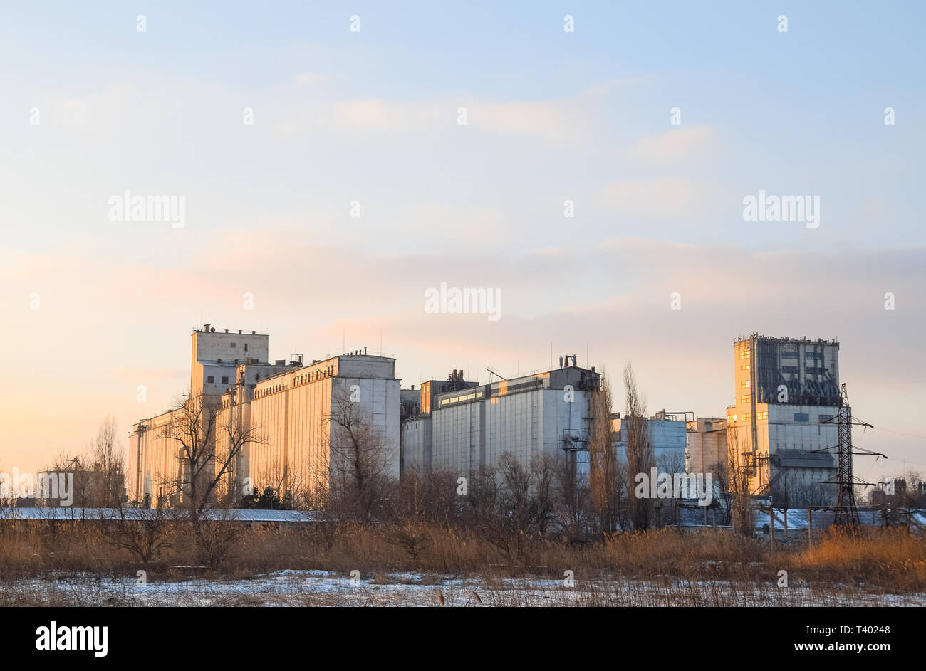 Building for storing and drying grain. Soviet-built elevator. Stock Photo