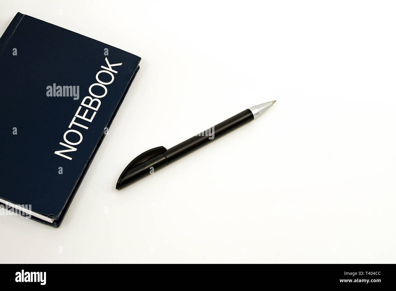 Pen and notebook isolated against a plain white background Stock Photo ...