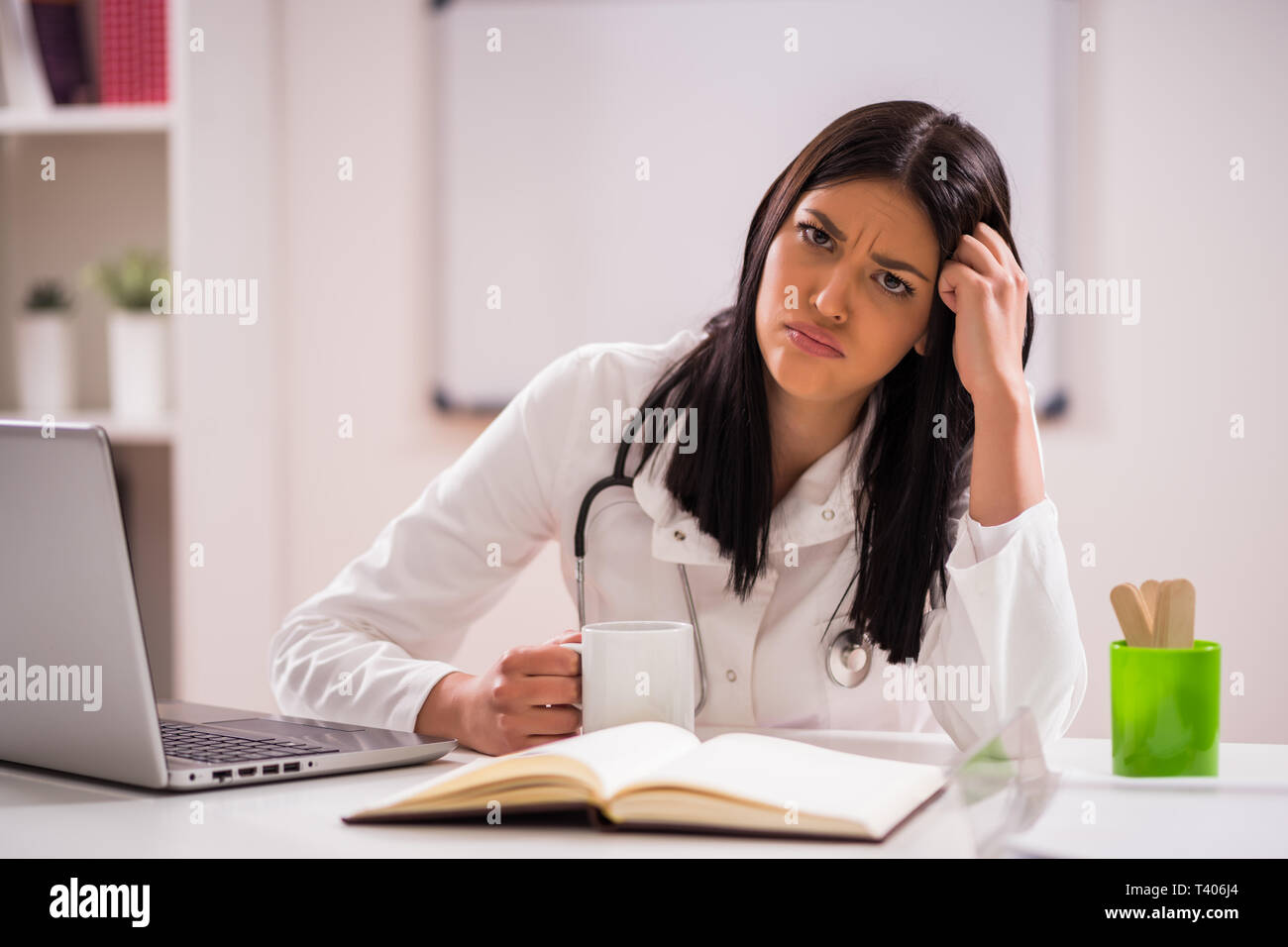 Young doctor is tired. Stock Photo