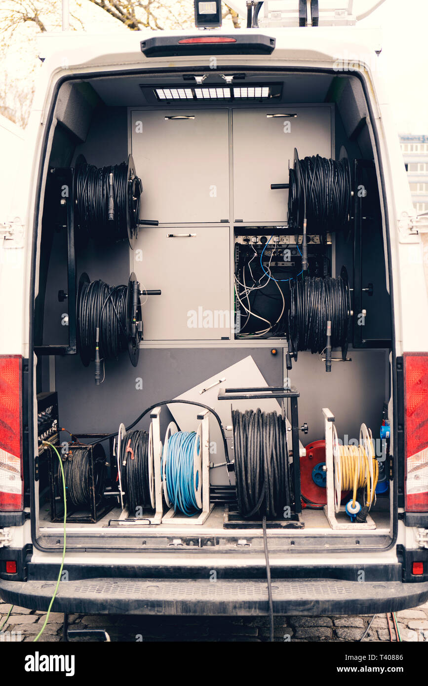 TV broadcast car. OB vans with cable. Stock Photo