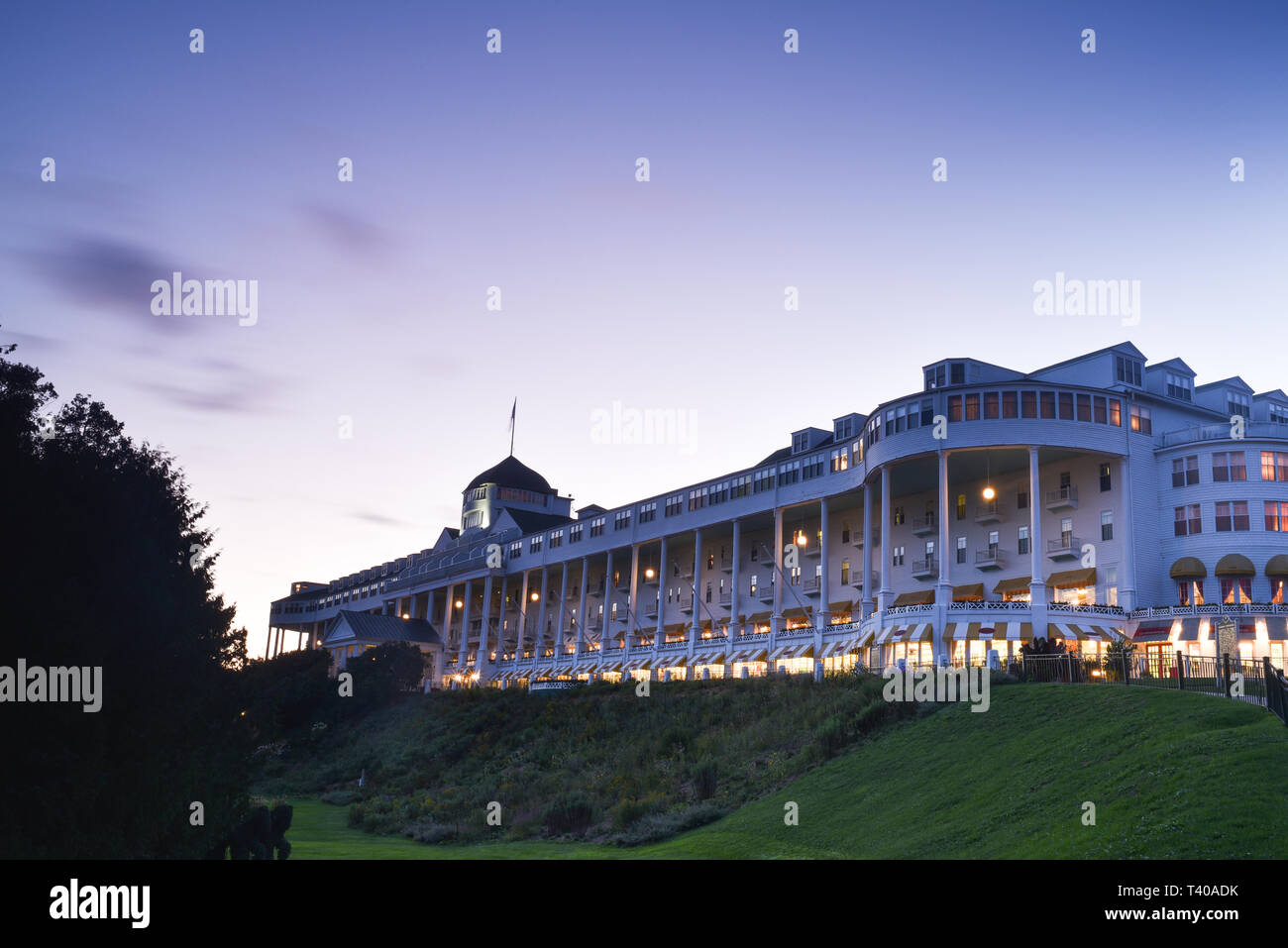 The historic Grand Hotel, built in 1887 and featuring the world's longest porch, captured at sunset, on Mackinac Island, Michigan, USA. Stock Photo