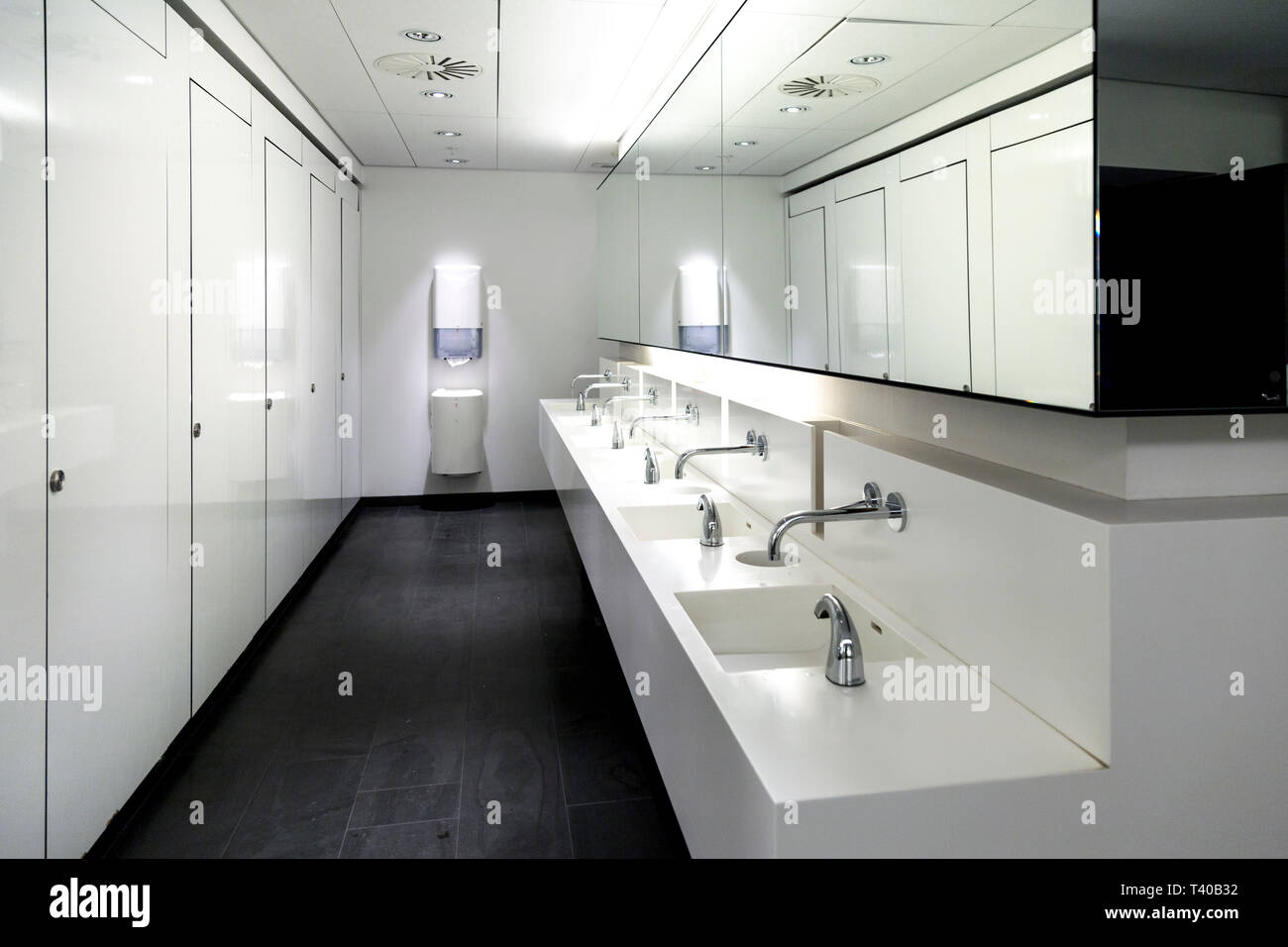 Monochromatic Contemporary Public Bathroom Interior Stock