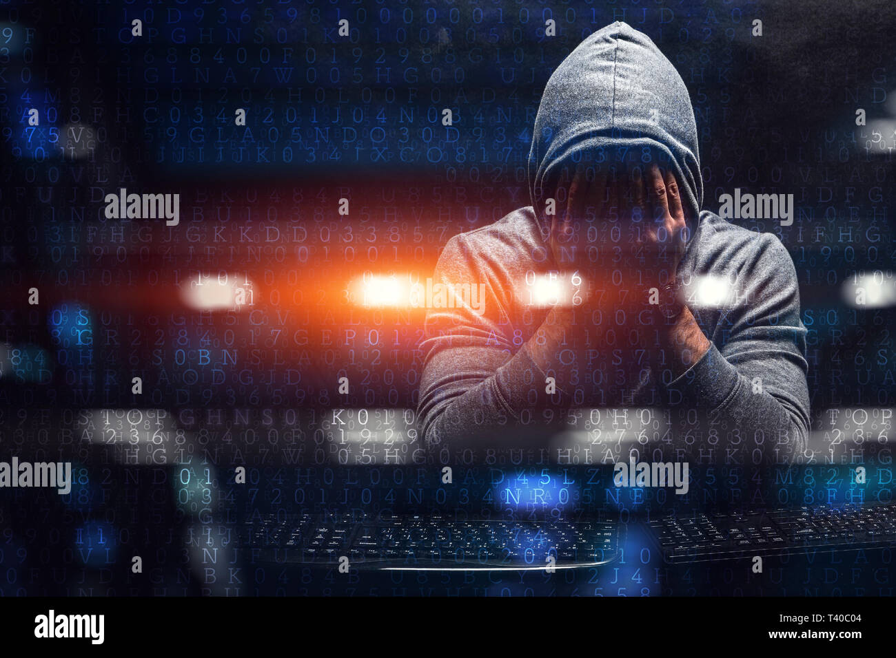 Hacker in hoodie hi-res stock photography and images - Alamy