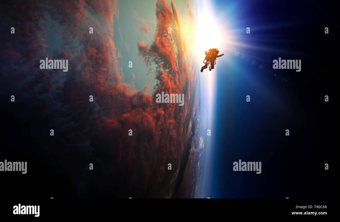 Spaceman and planet, human in space concept Stock Photo - Alamy