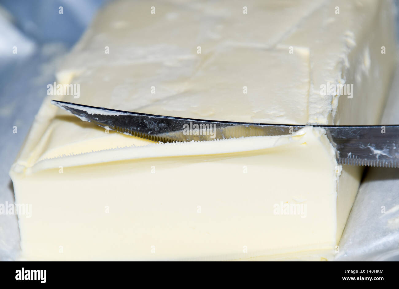 Cutting a butter knife. Butter and knife Stock Photo Alamy