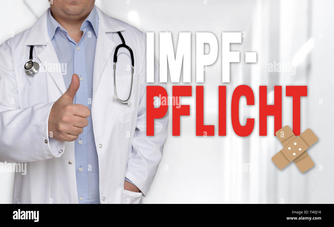 Impfpflicht (in german Vaccination) concept and doctor with thumbs up. Stock Photo