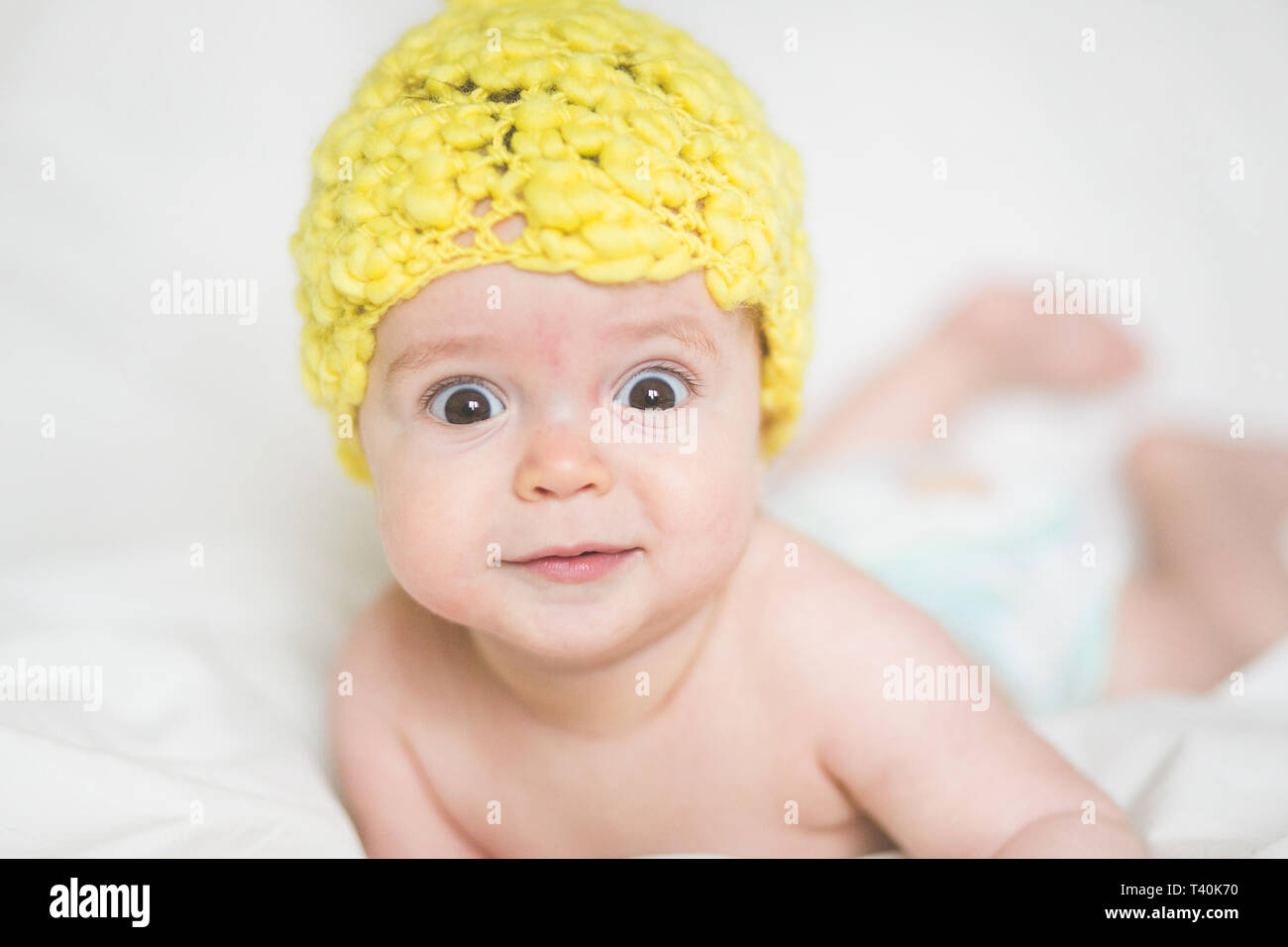 adorable newborn baby on a bed Stock Photo Alamy