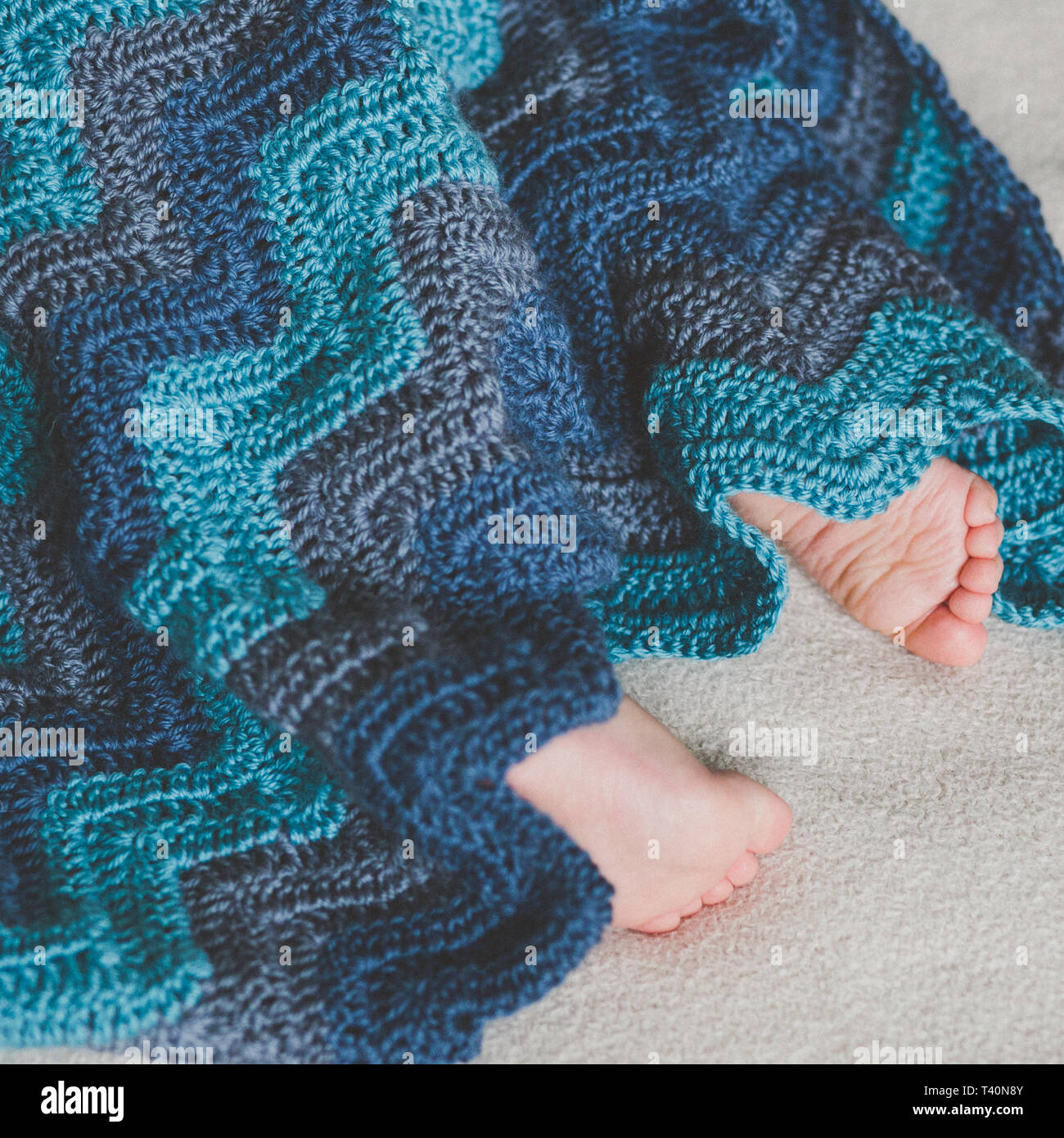 Newborn baby feet. Close up of newborn baby feet covered with the