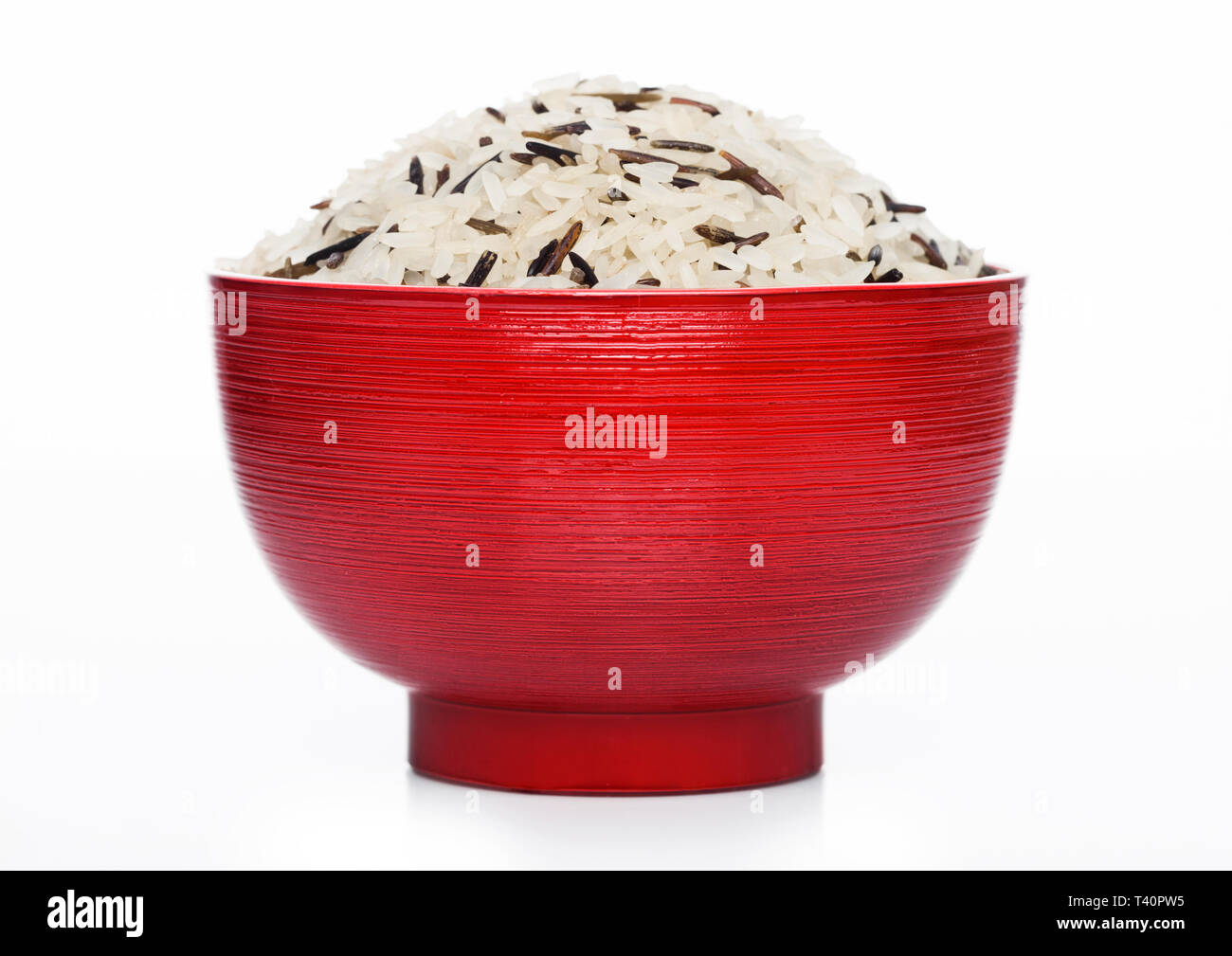 Red bowl of raw organic basmati long grain and wild rice on white ...