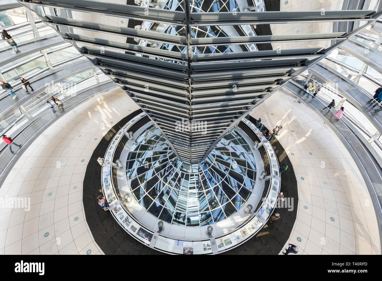 High-angle view of mirrored cone and interior of the futuristic glass dome on top of the Reichstag (German parliament) building in Berlin, Germany. Stock Photo