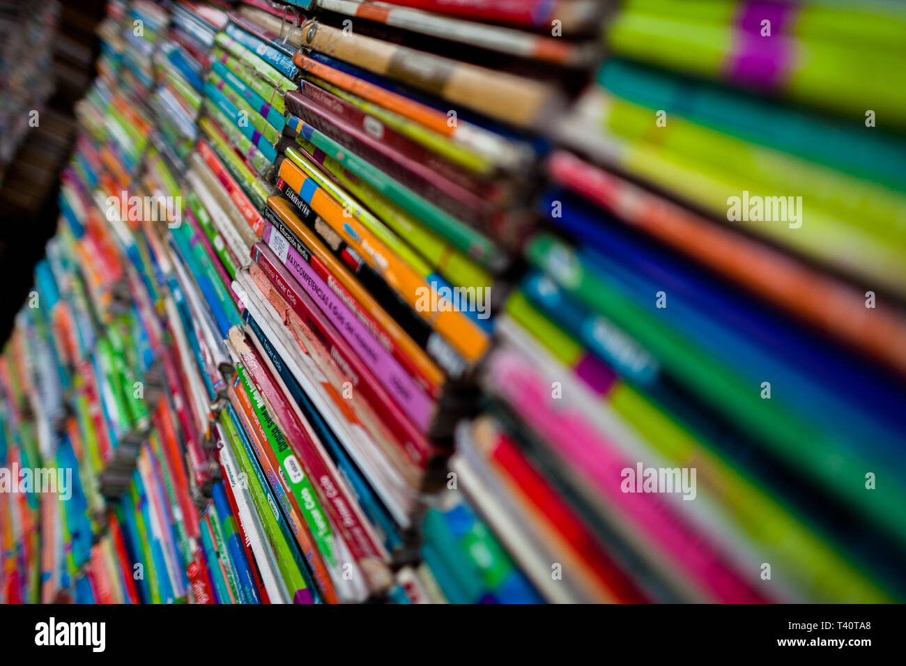 Spines of used books are seen stacked in a secondhand bookshop in San Salvador, El Salvador. Stock Photo