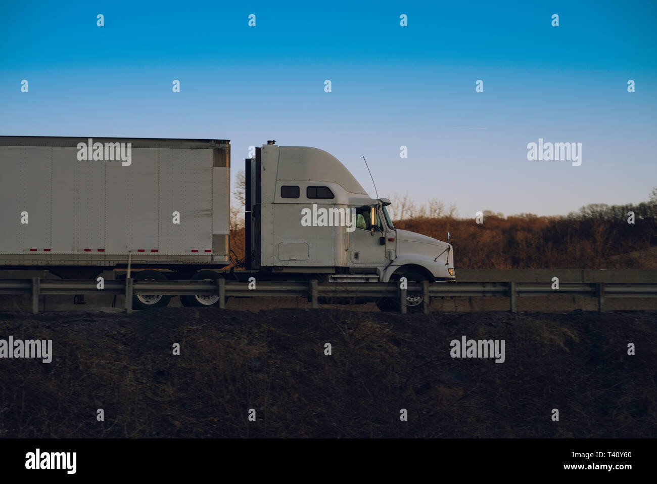 Semi truck 18 wheeler on highway Stock Photo