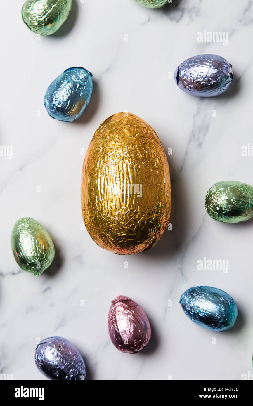 Easter egg chocolate treats wrapped in shiny coloured foil Stock Photo