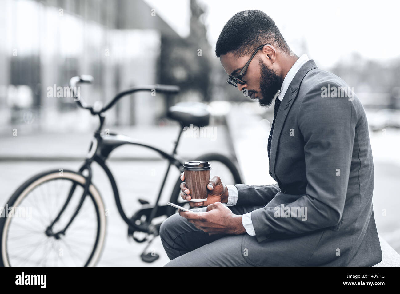 Handsome businessman browsing internet during coffee break Stock Photo