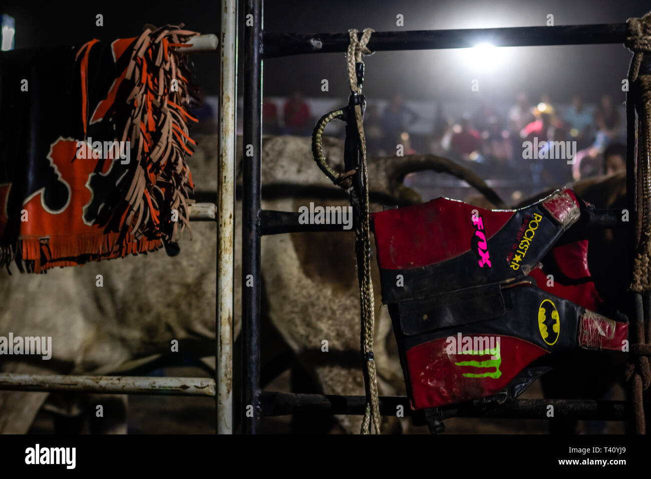 bull riding gear hanging on gate in Guatemalan rodeo Stock Photo Alamy