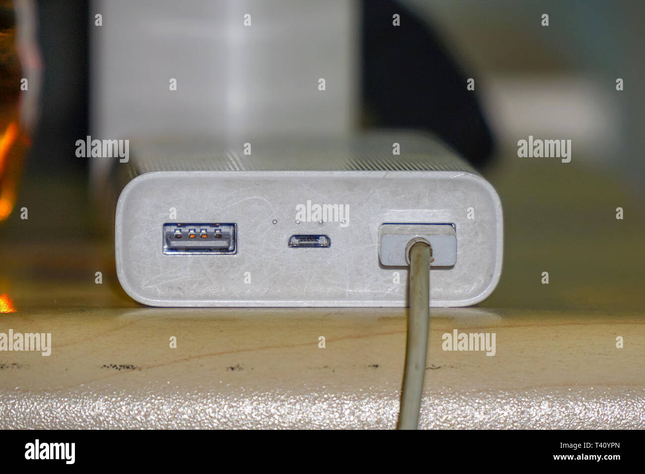 Powerbank for charging gadgets on the table Stock Photo