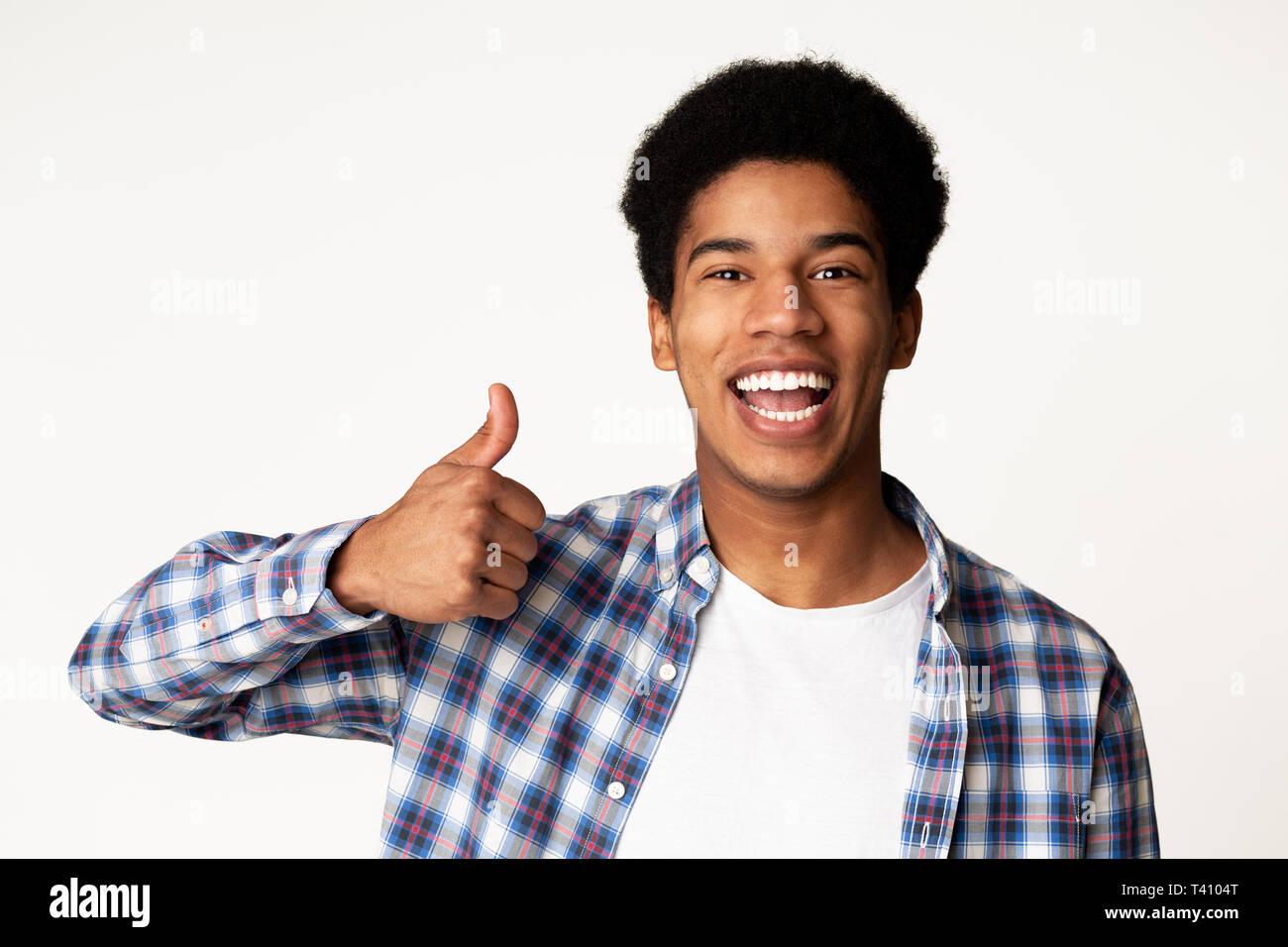 Happy afro-american guy showing thumb up gesture Stock Photo