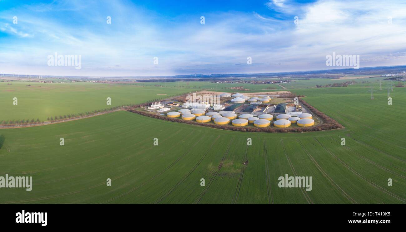 Aerial view of a big biogas plant between green agricultural fields in germany - green clean energy Stock Photo