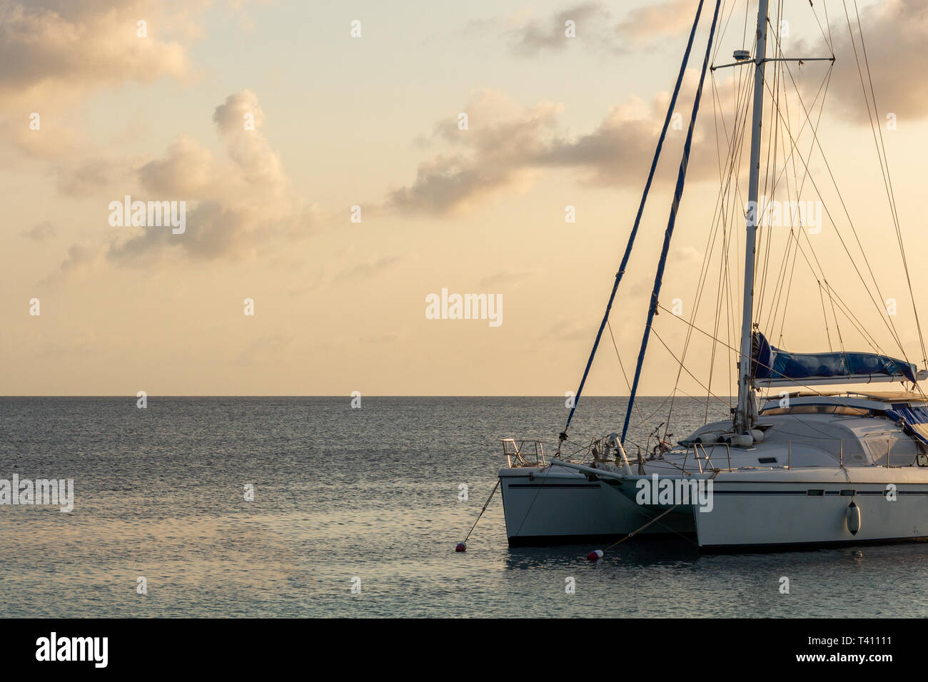 Catamaran boat in the Carribean sea at sunset Stock Photo