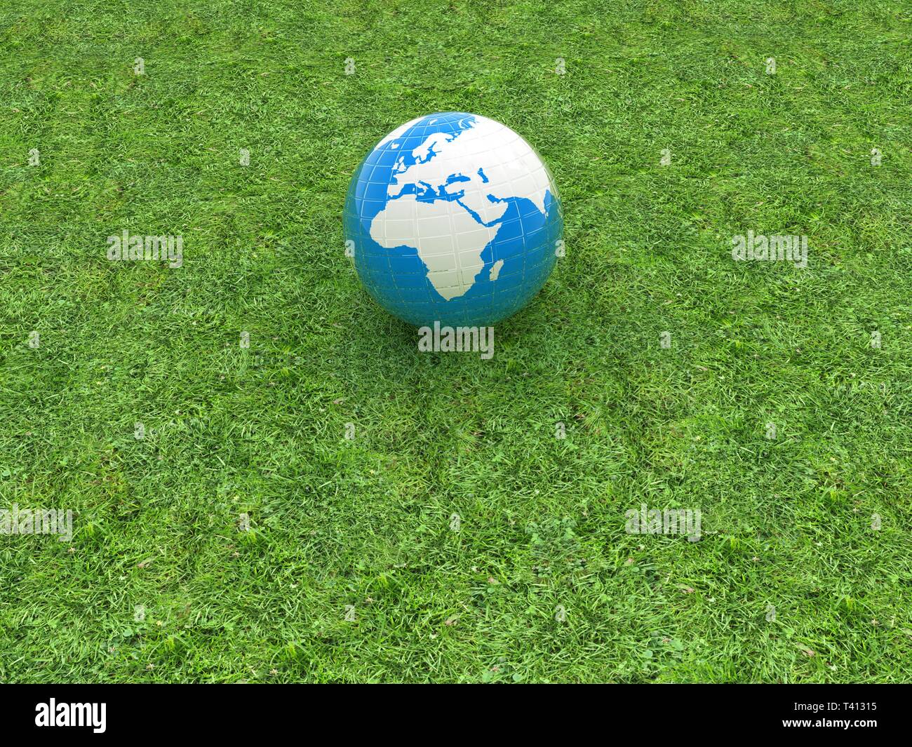 earth on a green grass Stock Photo - Alamy