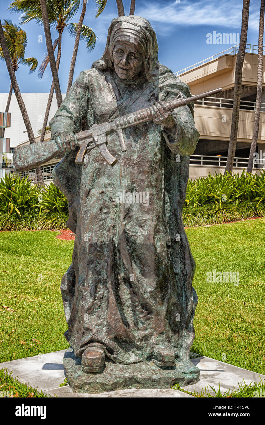 Miami, USA - 10. April 2014: This large bronze statue of Mother Teresa is one of nine works in Bayfront Park for Art Basel. The exhibit titled WAR to  Stock Photo
