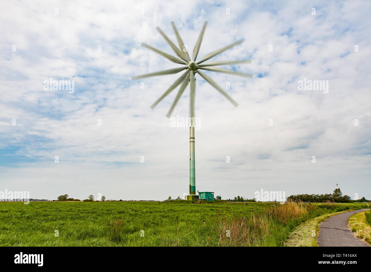 Wind turbine with several rotor blades - photomontage Stock Photo