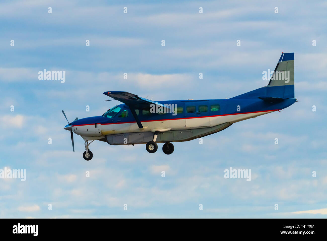 Single engine plain flying in the sky, British Columbia, Canada Stock Photo