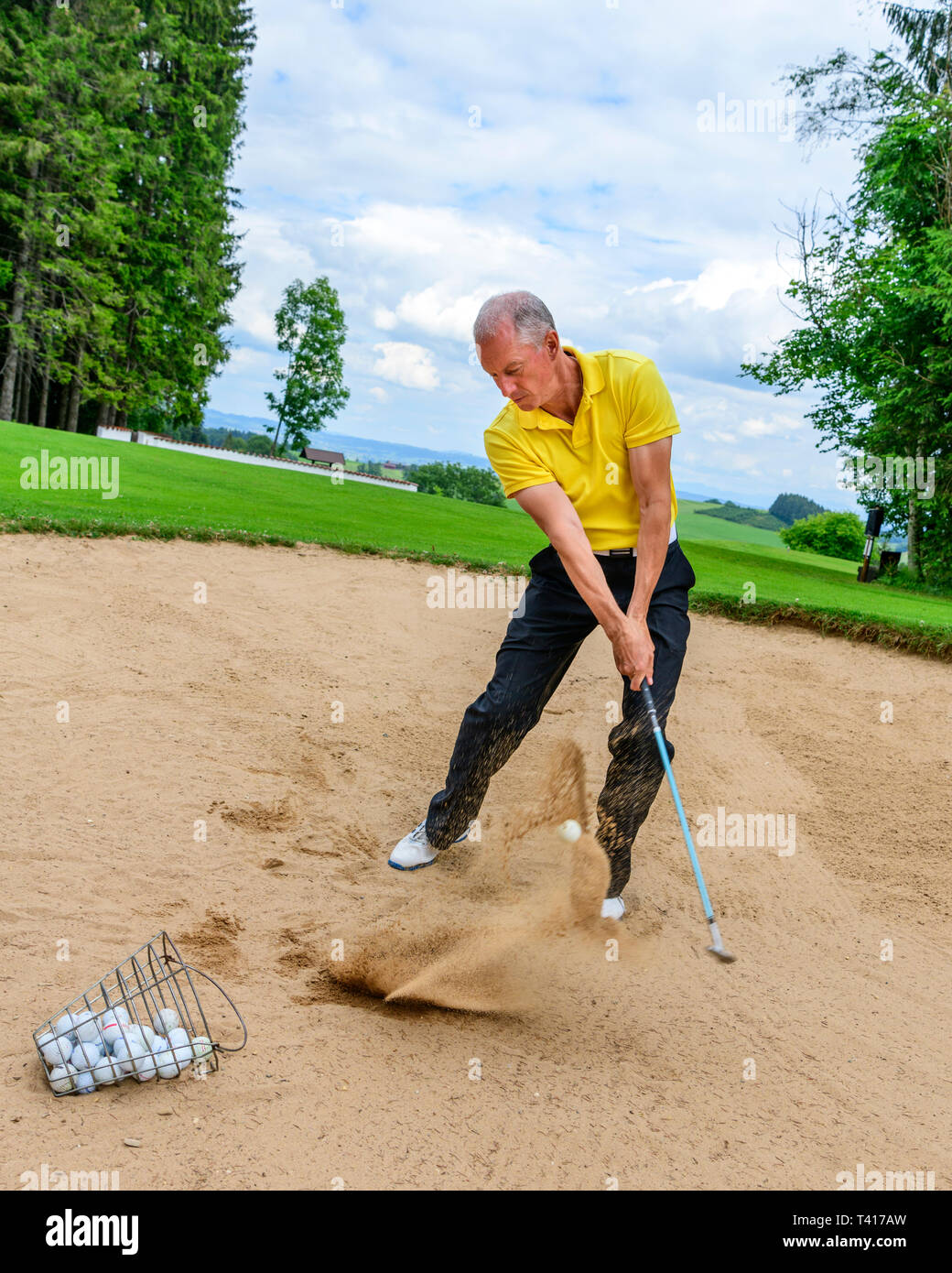Golf training lesson in sandbunker Stock Photo