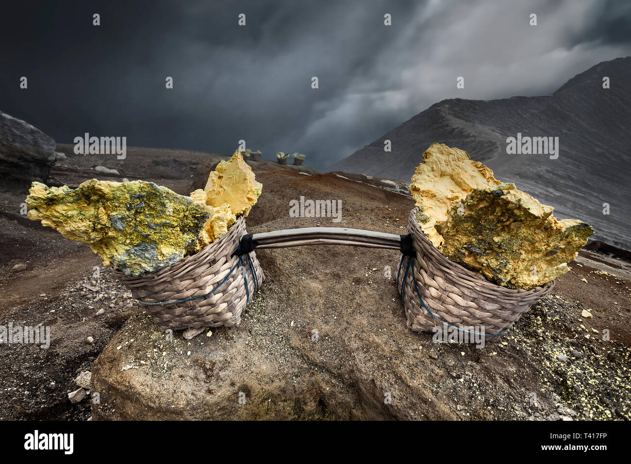 Baskets of mined Sulphur, Mount ljen, Banyuwangi, East Java, Indonesia Stock Photo