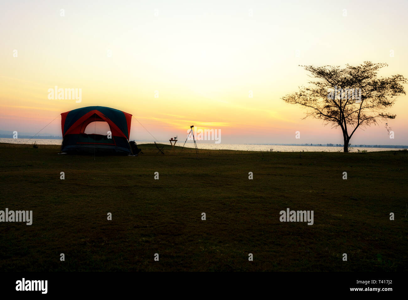 Tent and camera tripod on beach at sunrise, Thailand Stock Photo - Alamy