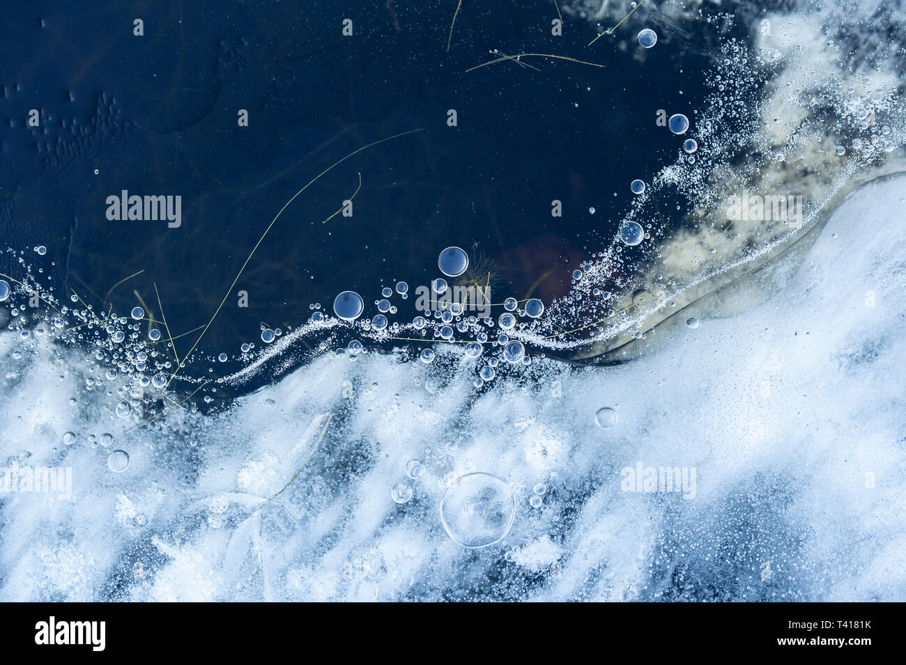 Frozen air bubbles in ice Stock Photo Alamy
