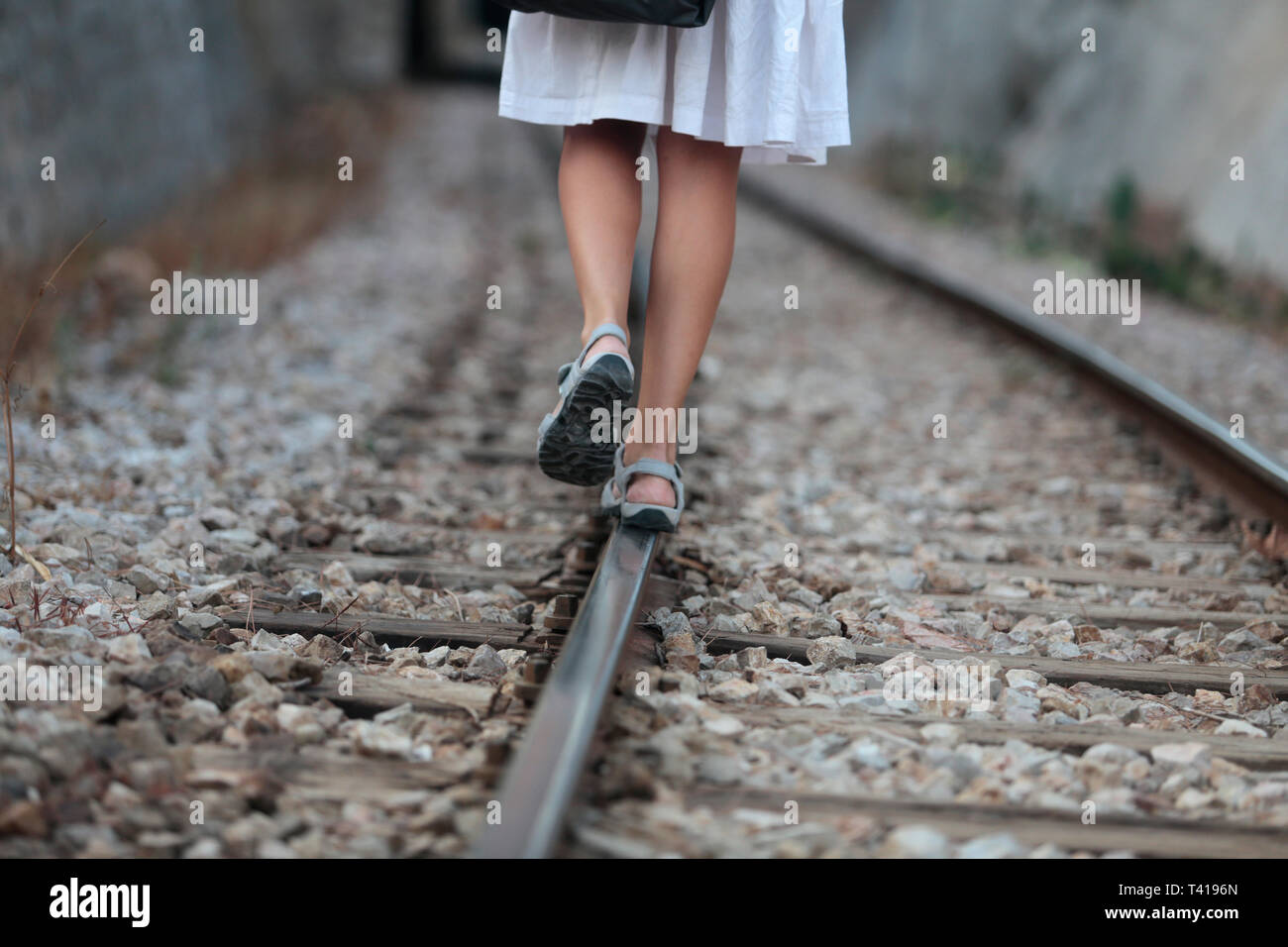 Woman walking on a railway track, Bunyola, Majorca, Spain Stock Photo