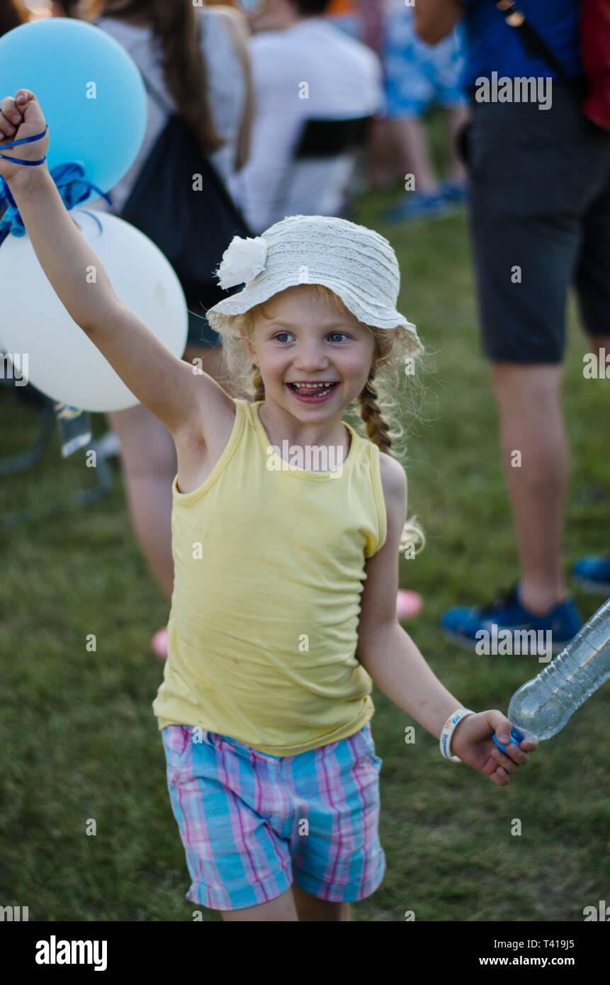 little girl playing with balloons Stock Photo - Alamy