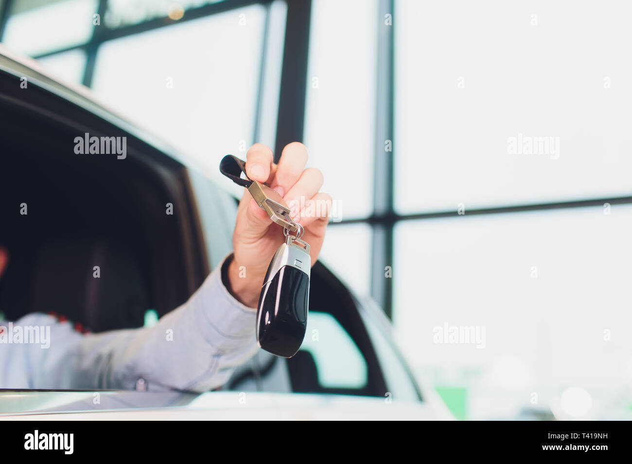 handsome middle aged man showing a car key inside his new vehicle Stock ...