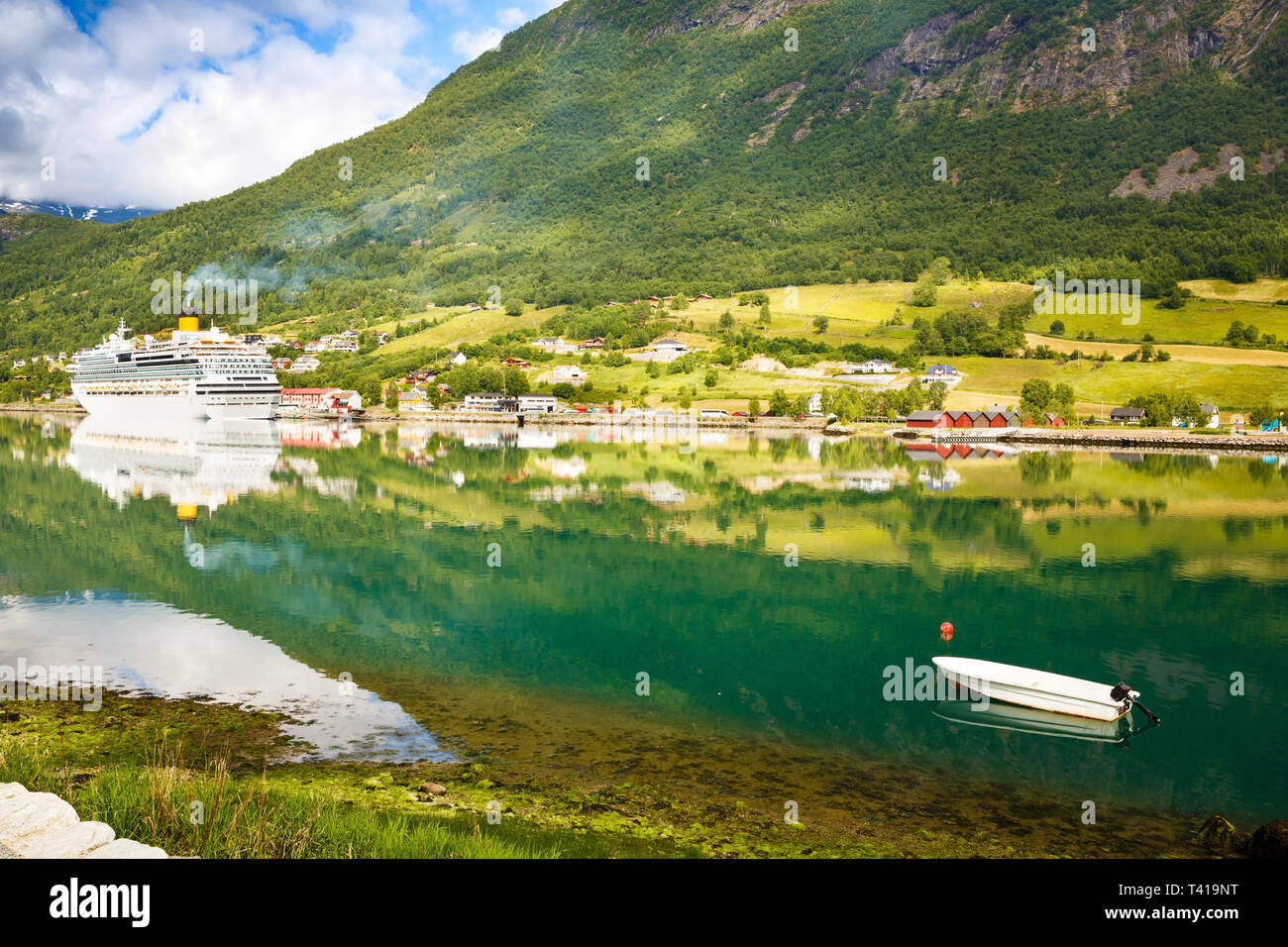 Landscape with mountains, cruise liner, village and fjord in Norway. Stock Photo