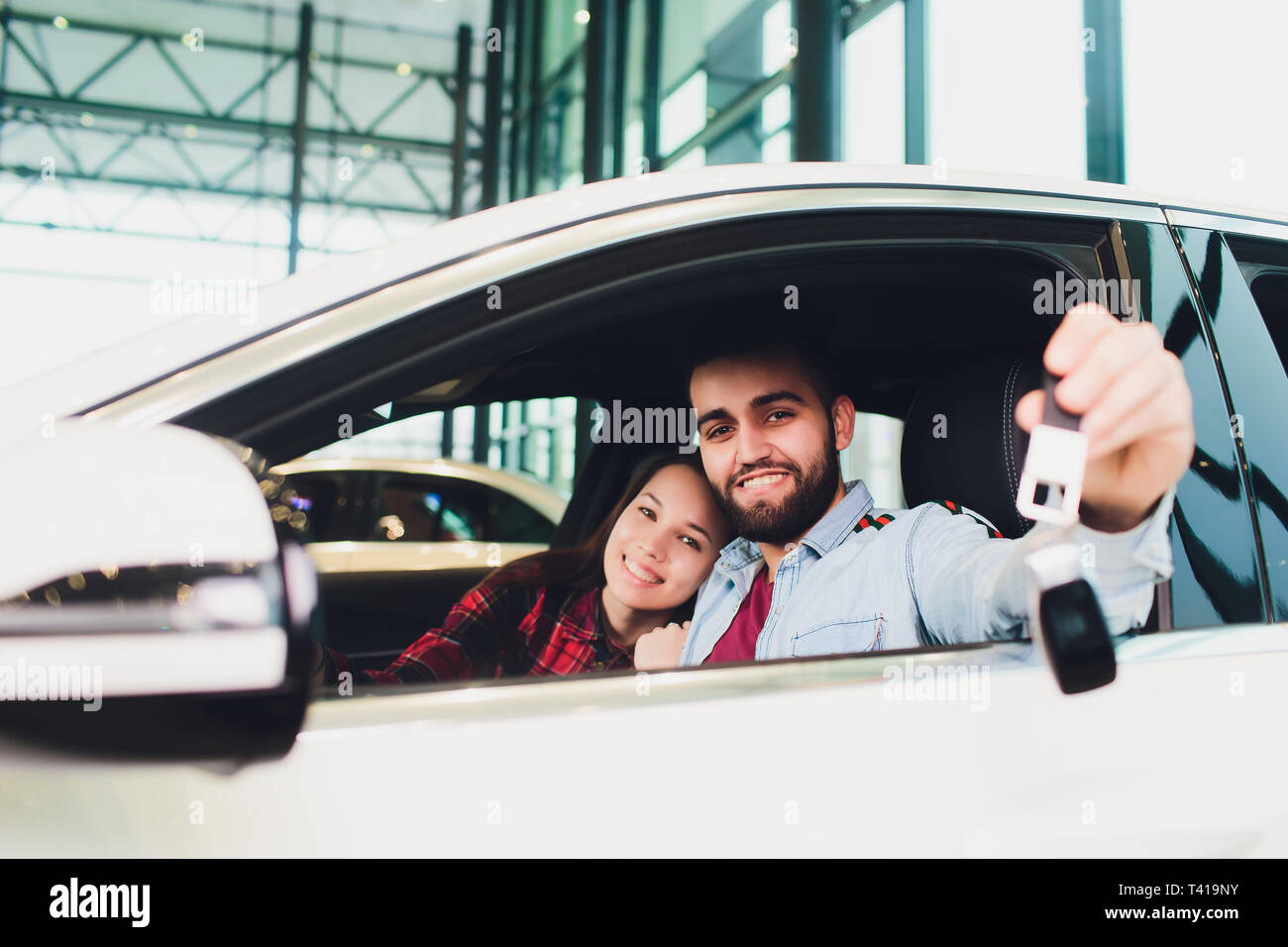 handsome middle aged man showing a car key inside his new vehicle Stock ...