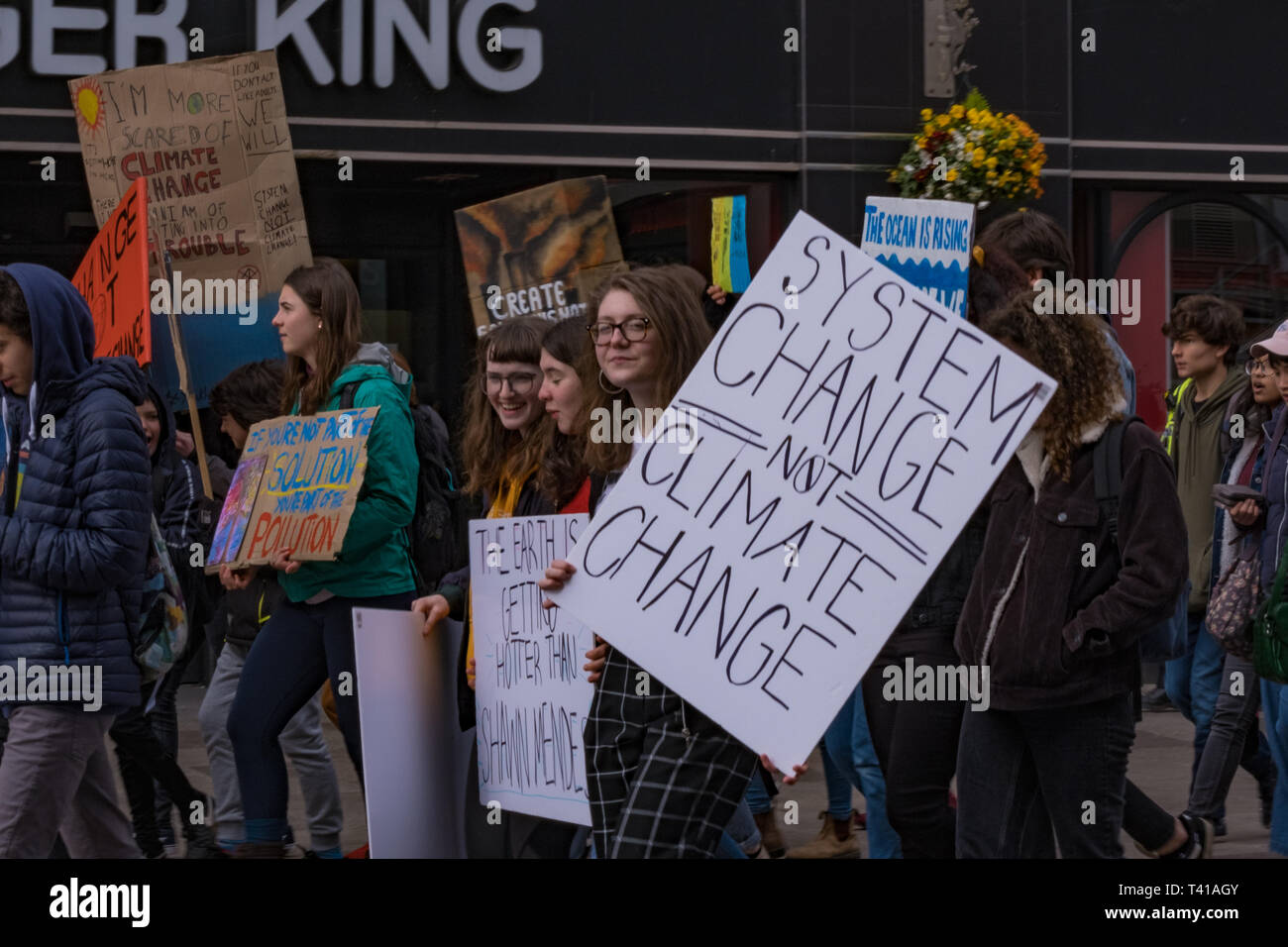Cardiff Wales UK 04/12/2019 Children, young adults and adults march down St. John Street and through Cardiff centre, protesting to the government. Stock Photo