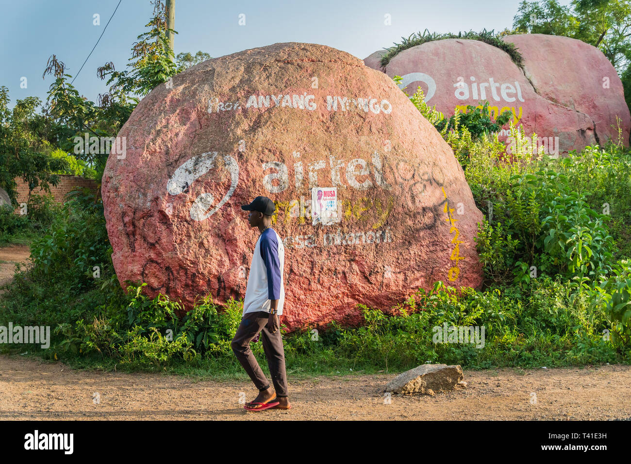 near Kisumu, Kenya - March 8, 2019 - advertisement of AirTel mobile phone service provider painted on huge boulders in the countryside Stock Photo
