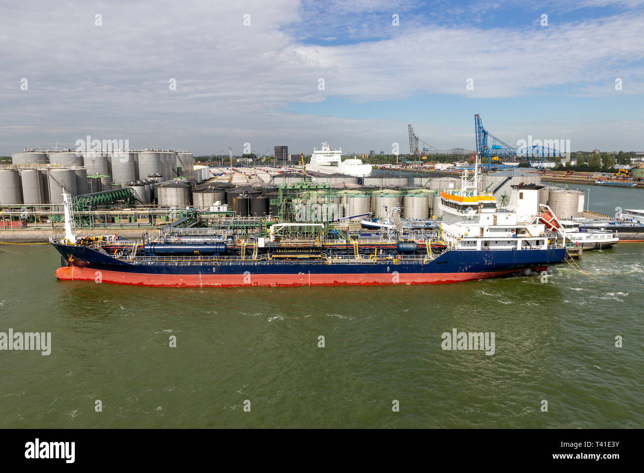 Oil tanker moored at a silo tank terminal in the Port of Rotterdam. Stock Photo