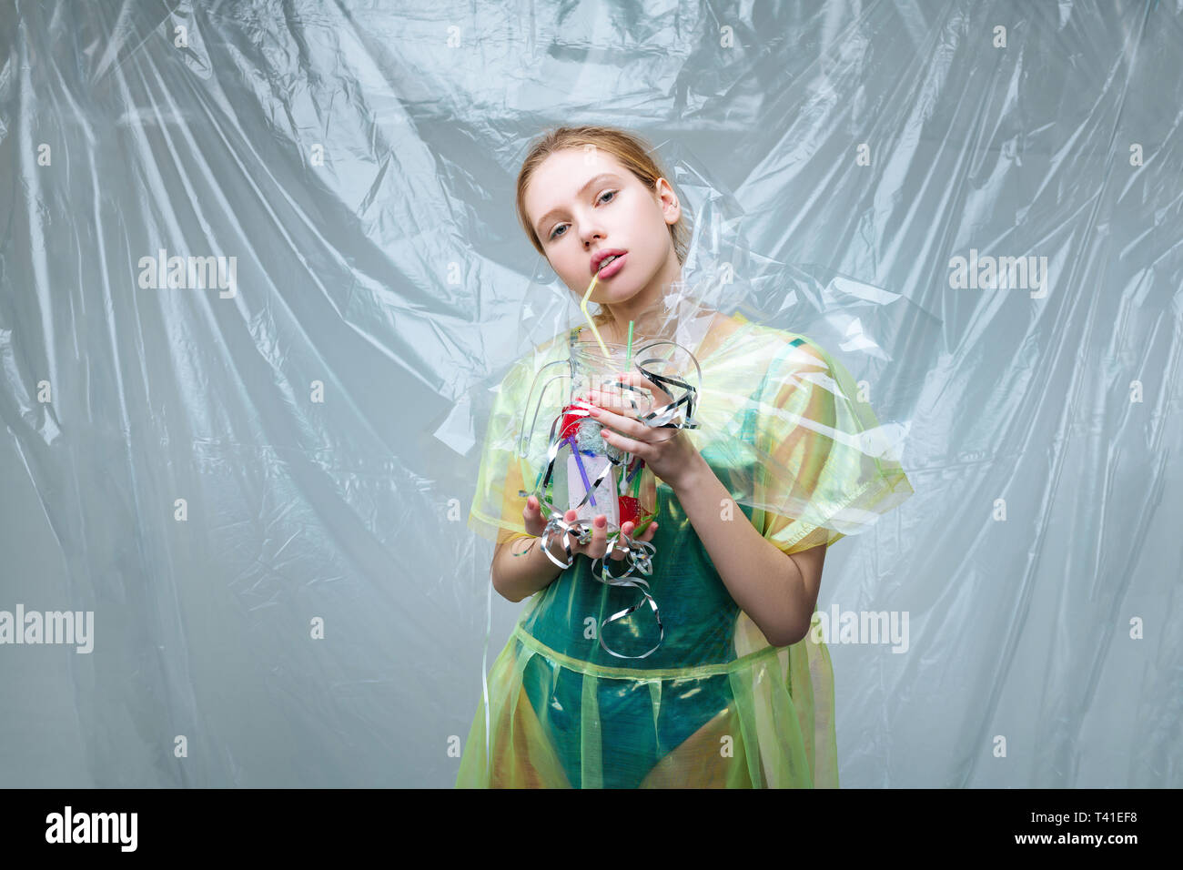 Environmental organization. Fair-haired model working for environmental organization posing with glass and plastic Stock Photo