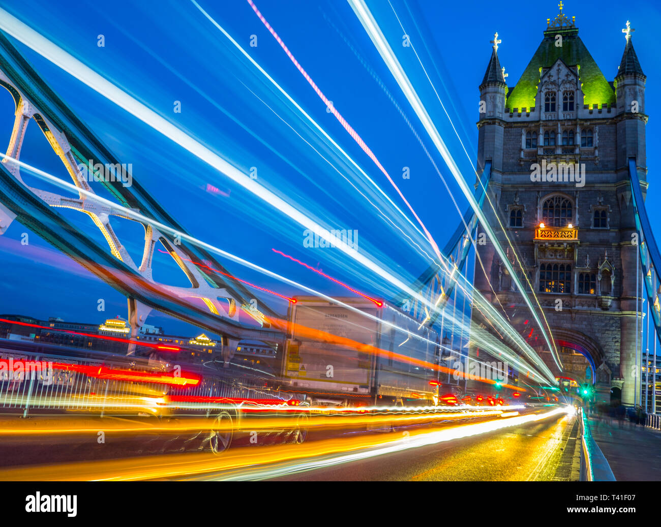 Tower Bridge at night with traffic trail lights, London, UK Stock Photo ...