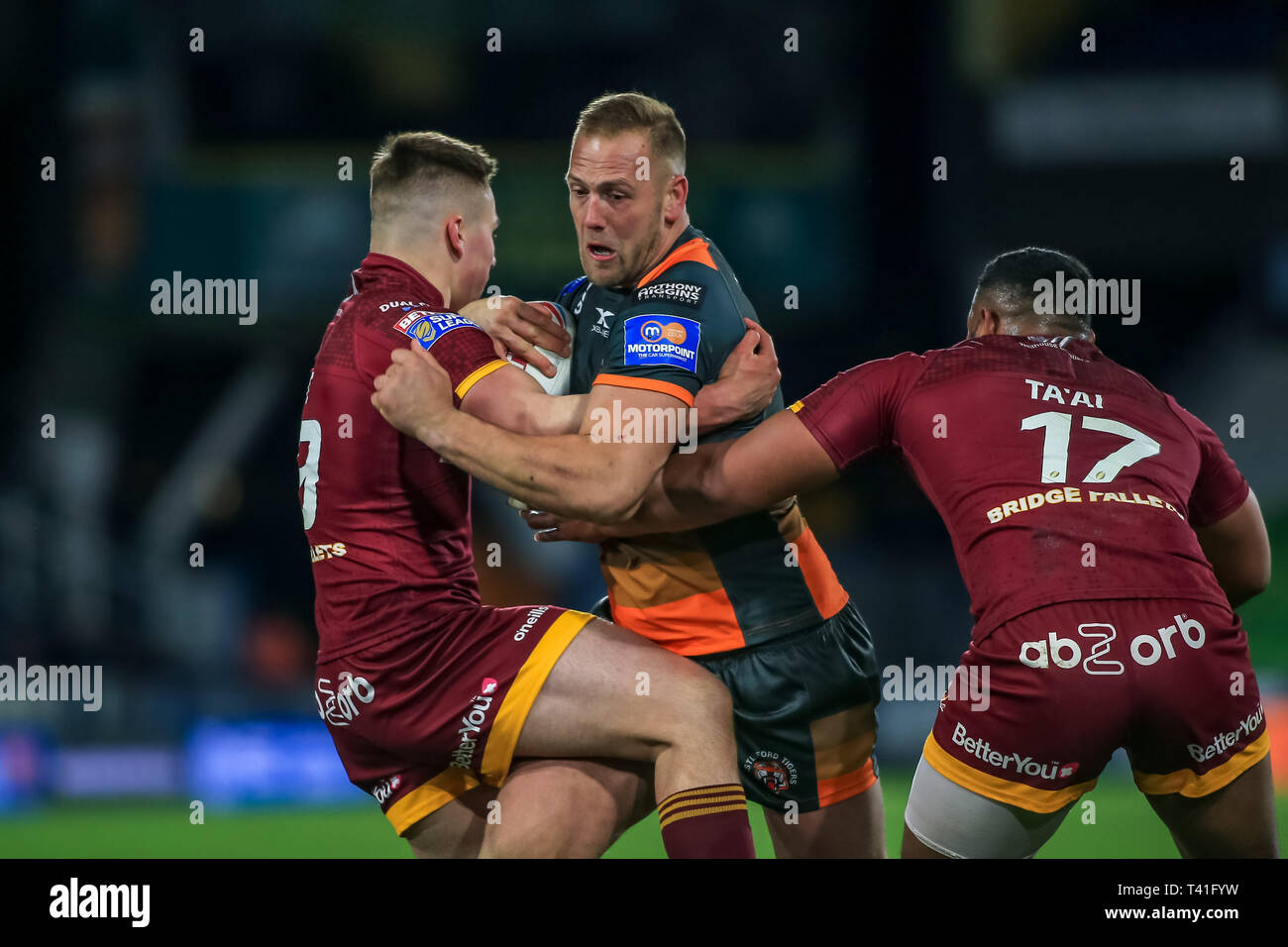 11th April 2019 , John Smiths Stadium, Huddersfield, England; Betfred Super League, Round 10, Huddersfield Giants vs Castleford Tigers ;   Liam Watts of Castleford Tigers  been tackled Credit Craig Milner/News Images Stock Photo