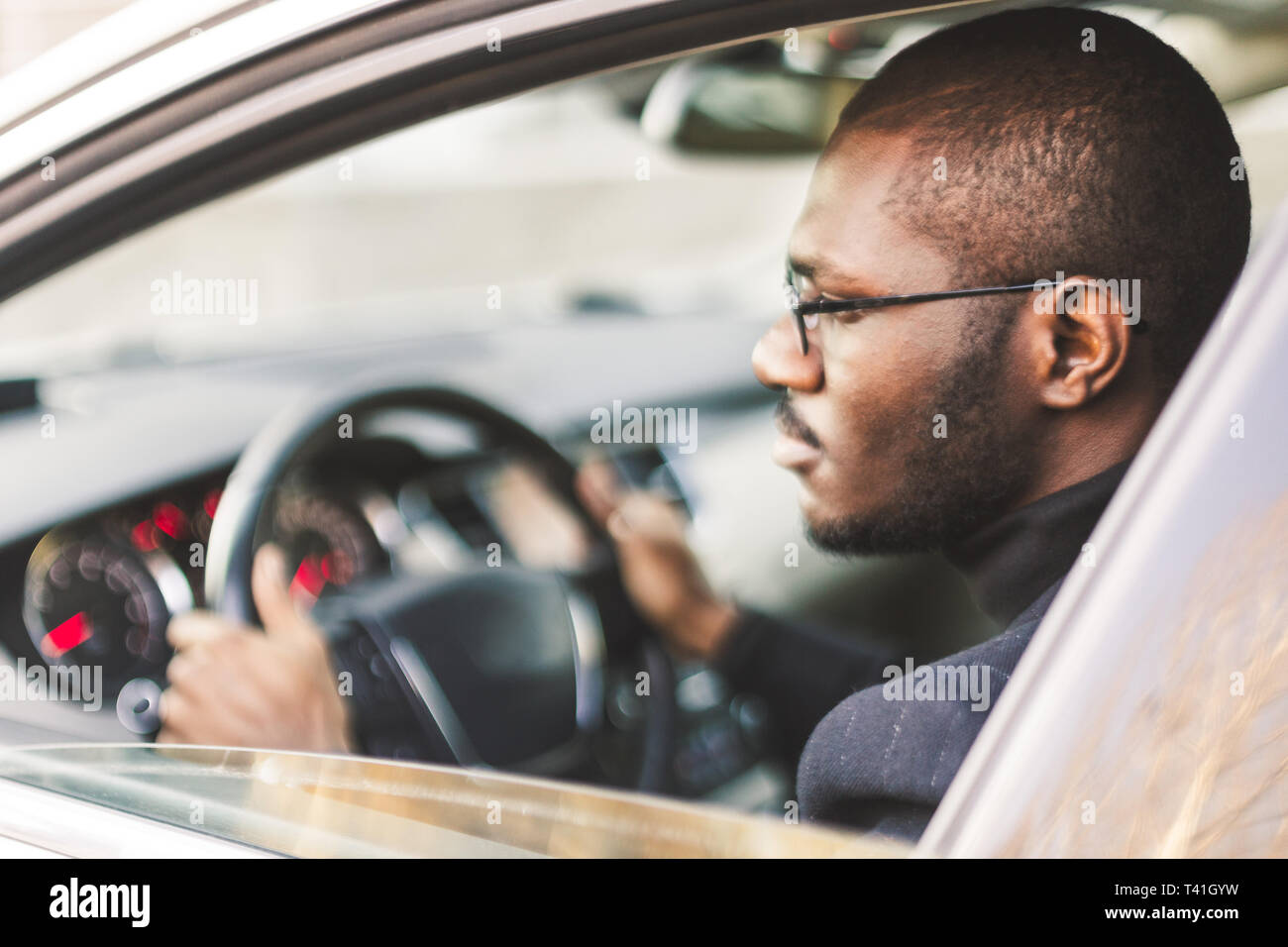 Businessman sits in black car hi-res stock photography and images - Alamy