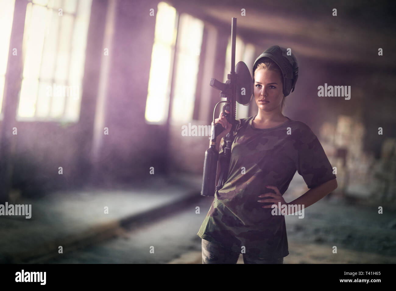 paintball woman with marker gun, paintball sport and leisure Stock Photo