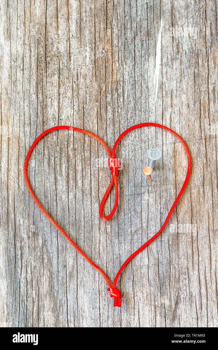 Heart shape with metal nails. relationship problem, heartbreak concept Stock Photo