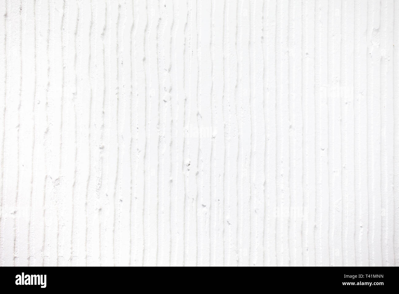 Closeup of the wall with a decorative white plaster vertical lines and  stripes. Textured concrete wall with as a texture or background. Repair,  design Stock Photo - Alamy