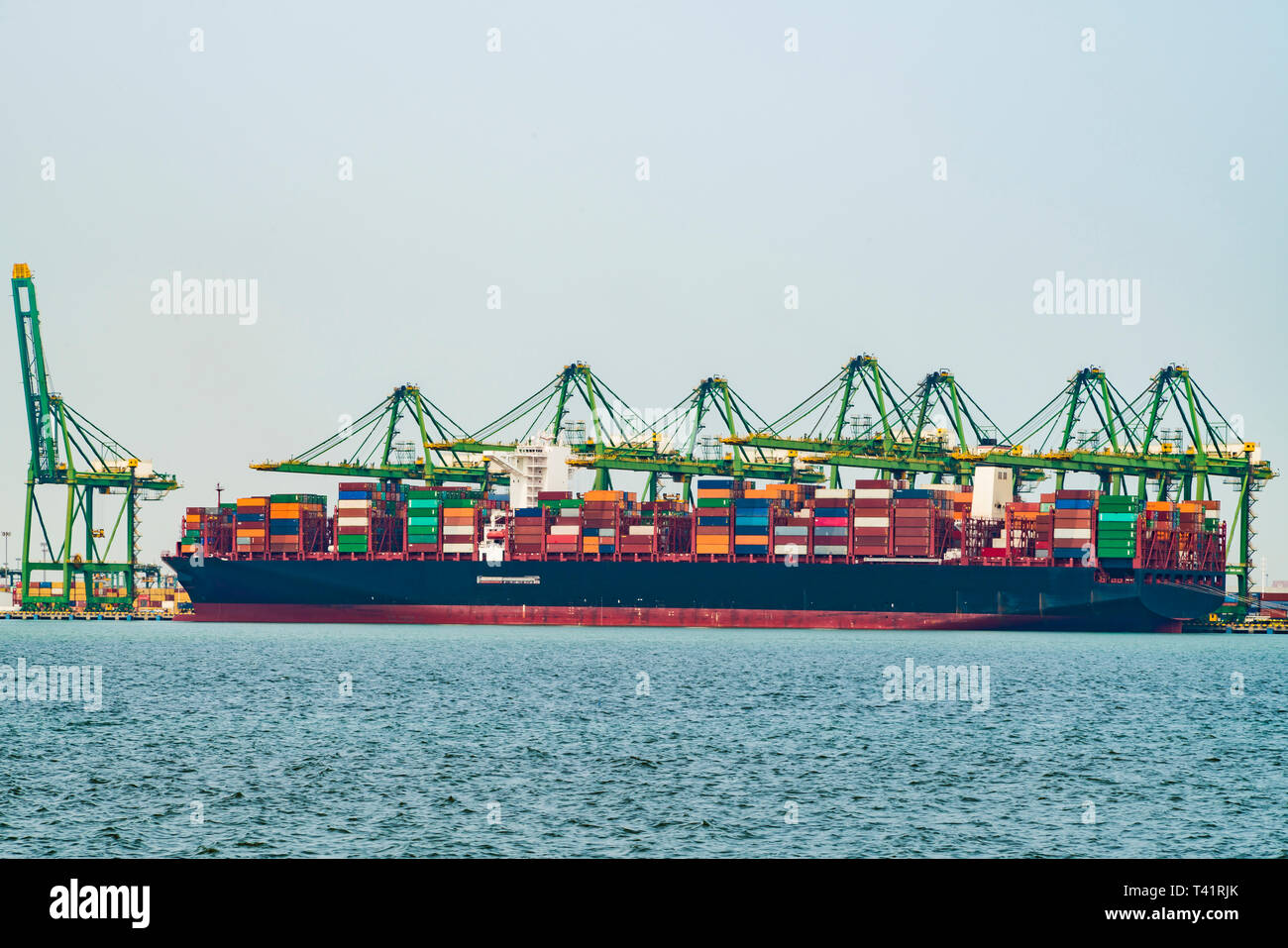 Cargo operations on a container ship in China Stock Photo